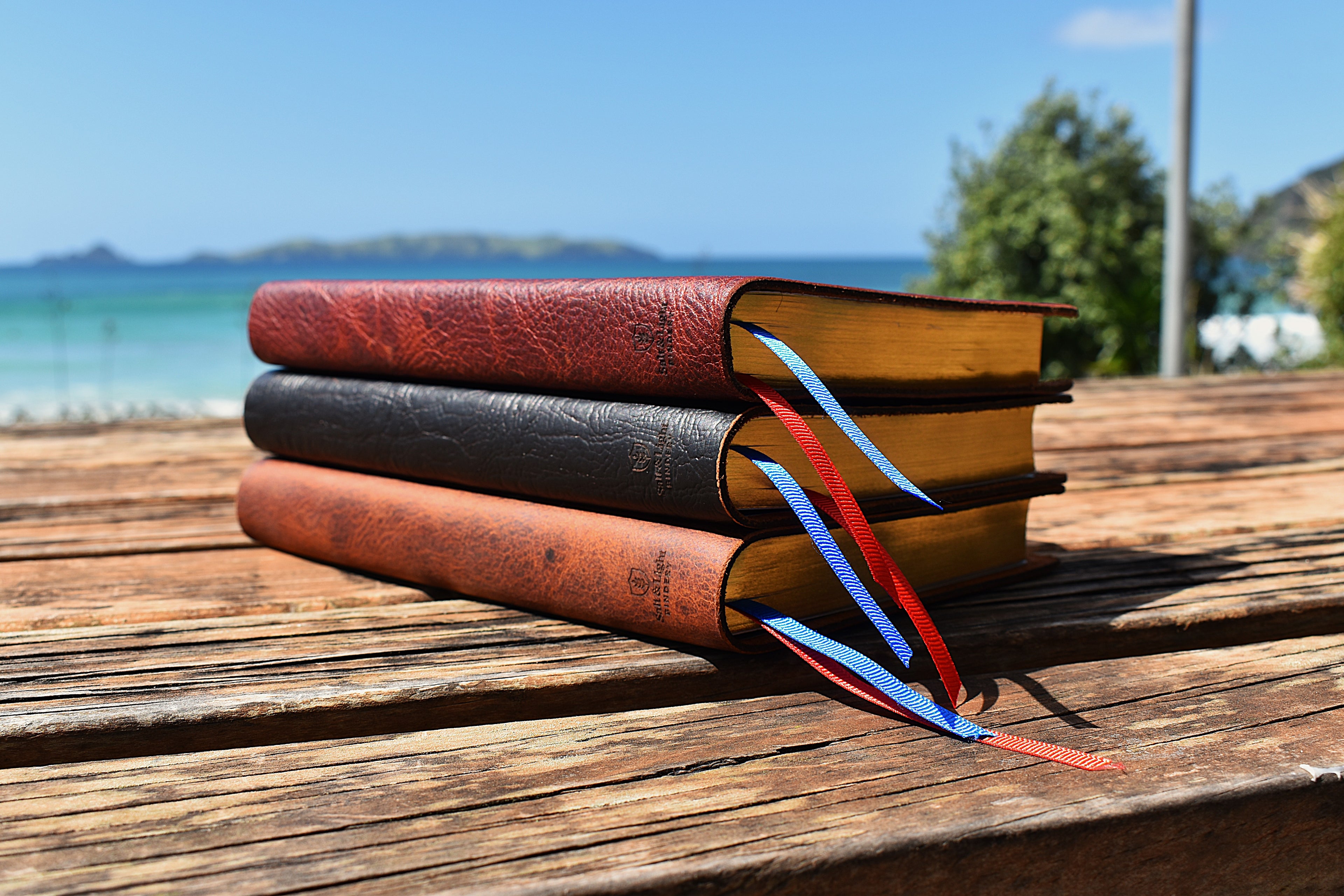 Set of three personalised custom engraved ESV Thinline Leather Bibles. Hand made and handbound from full grain leather by Salt and Light Bindery NZ